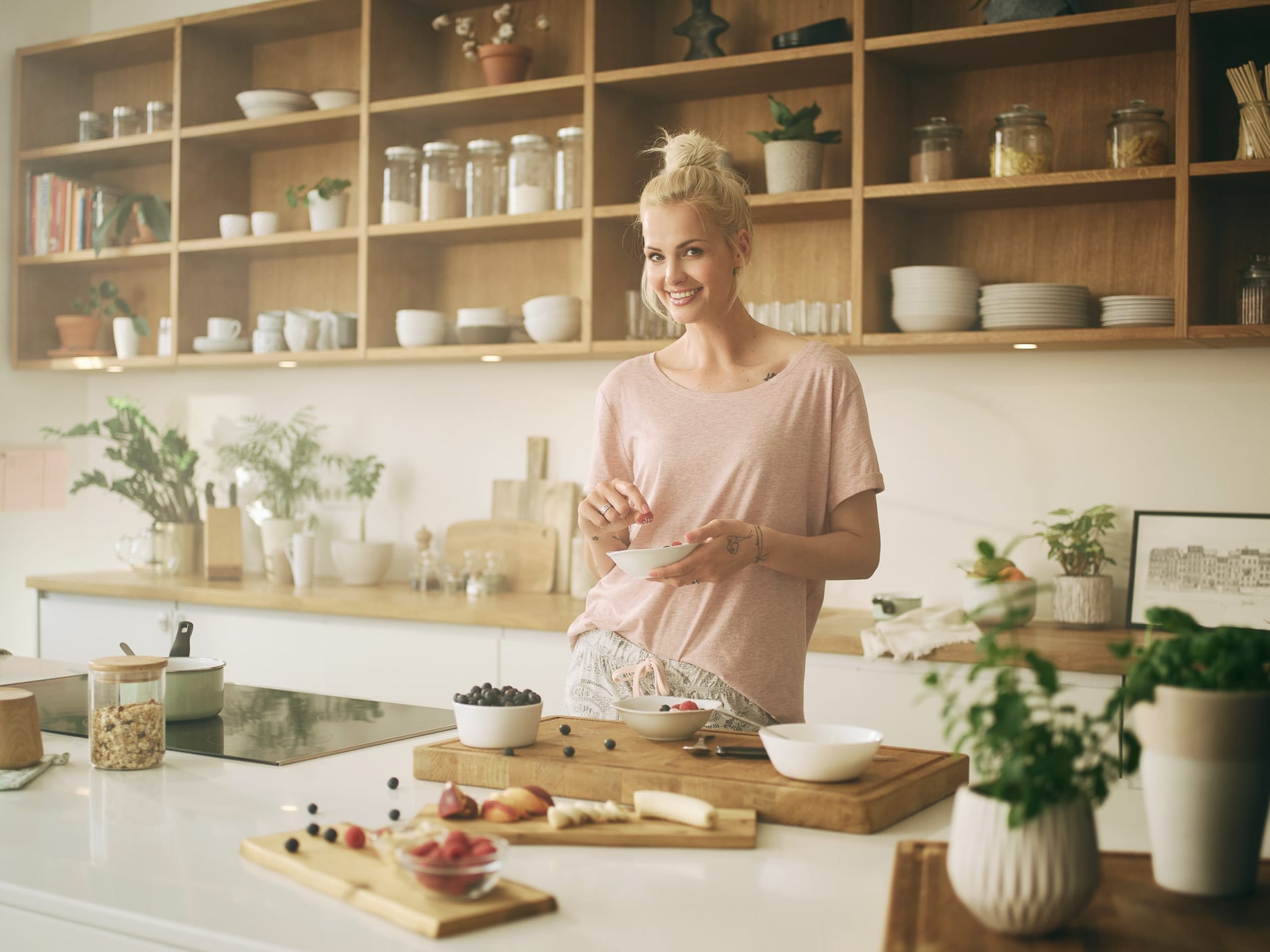 Squareme Zala ad. Tjaša Kokalj, young Slovenian model, in a modern kitchen preparing breakfast.