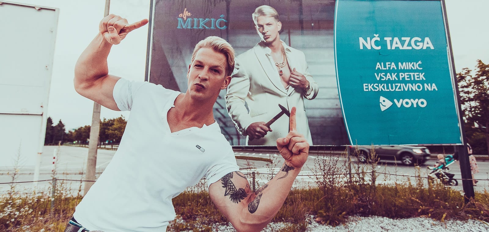 Squareme Alfa Mikić web series. Actor Igor Mikić posing in front of a billboard advertising the series