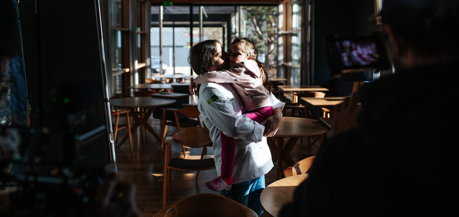 Squareme Mastercard Sous Chef campaign for Michelin star winners in Slovenia - Gregor Vračko and his daughter are higging in the dining room of his award winning restaurant Hiša Denk while a film crew is filming them